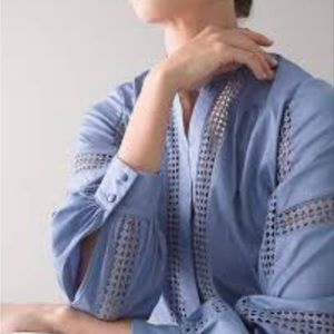 NEW WITH TAGS White House Black Market blue blouse with lace design. Size M